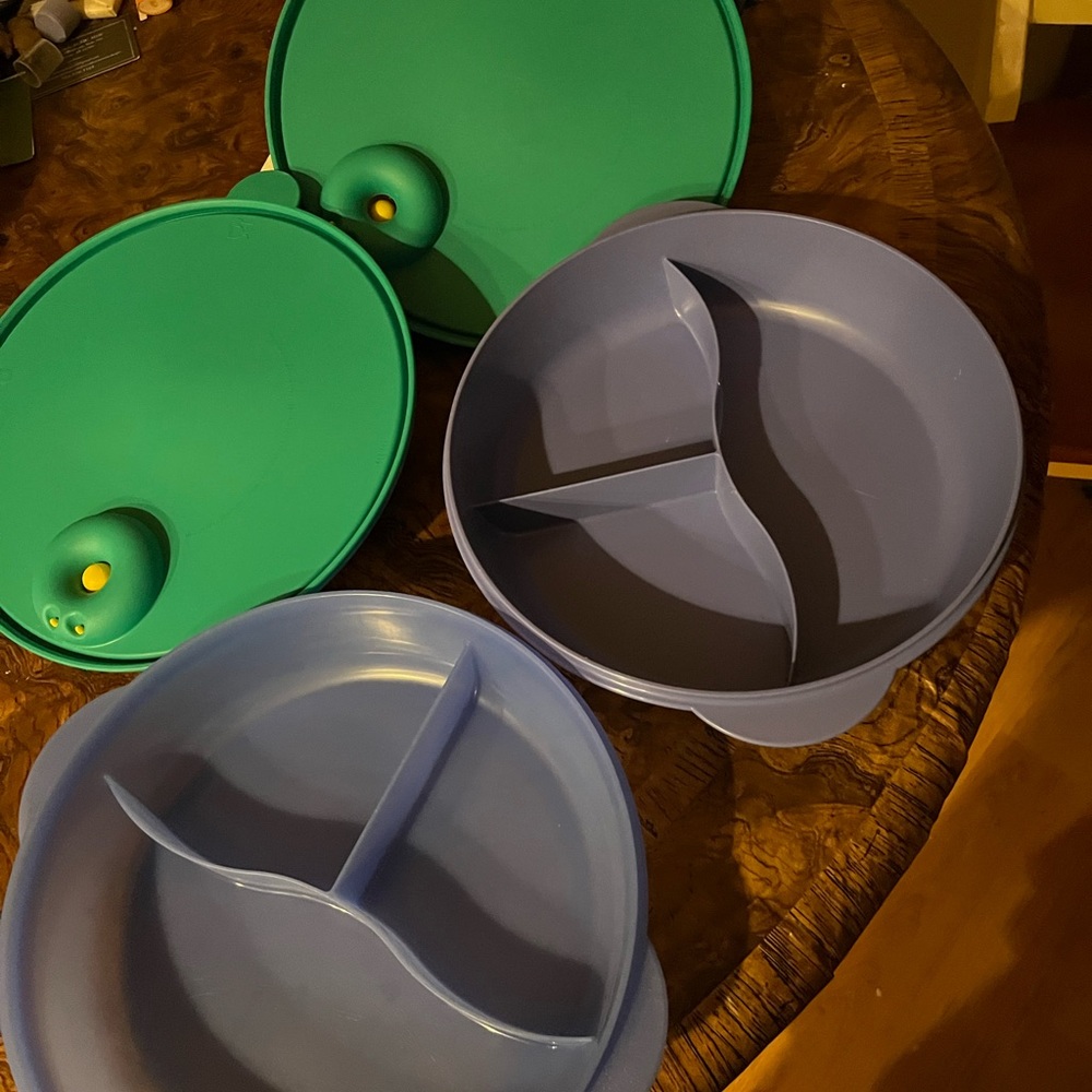 Two microwaveable Tupperware food storage containers